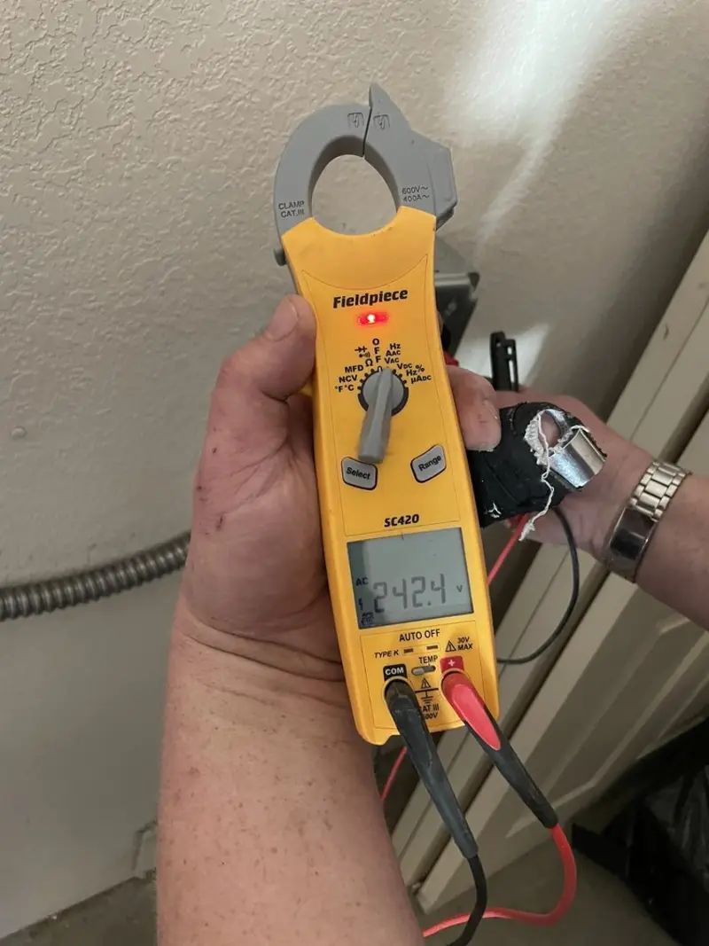 Voltage testing with clamp meter during Whole House Surge Protector in Central Point